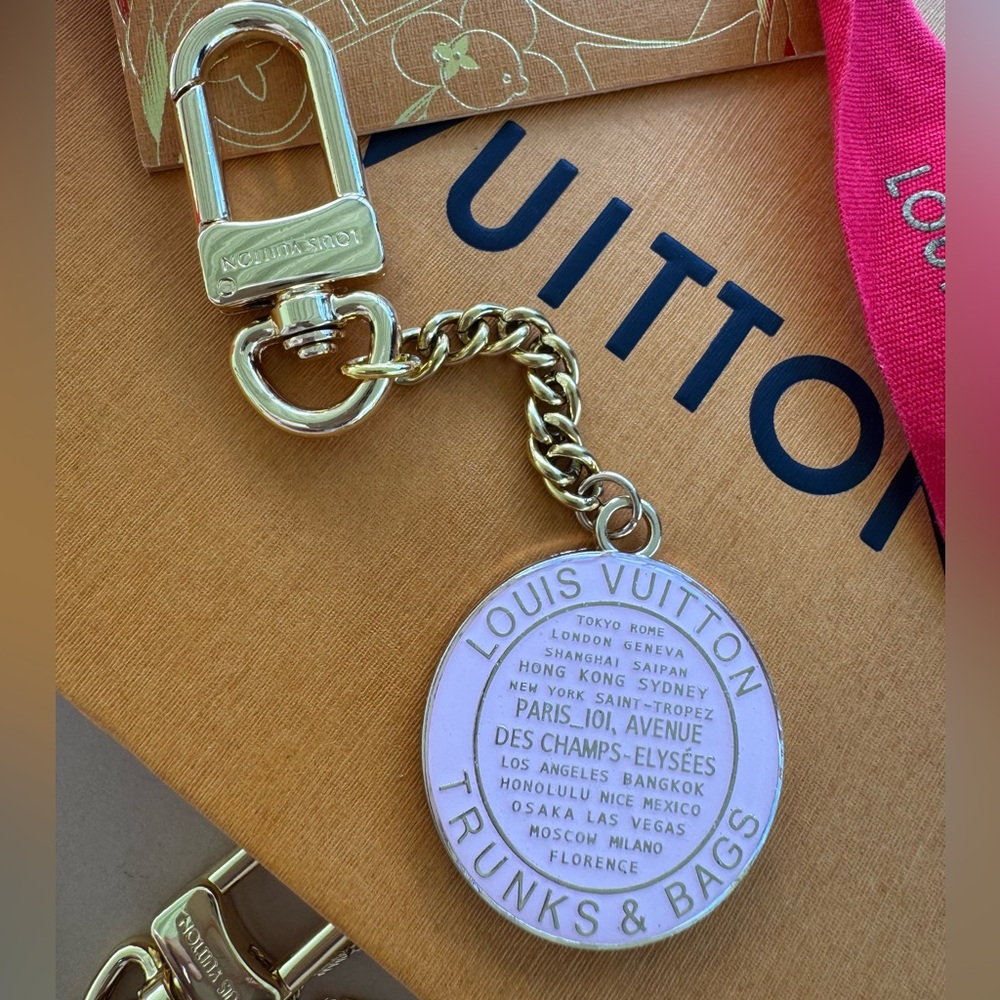 Lv luxury pink and gold Trunks and Bags medallion key chain or bag charm.
